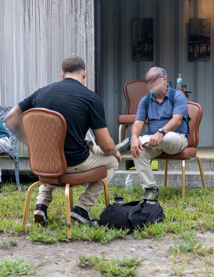 A Marine Raider, assigned to Marine Forces Special Operations Command, communicates with a “role-player” during the Culture Role-Play culminating event as part of the Basic Language Course on Camp Lejeune, North Carolina, Aug. 29, 2023. All critical skills operators attend the 16-week-long Basic Language Course after becoming CSOs. (U.S. Marine Corps photo by Sgt. Evan Jones)