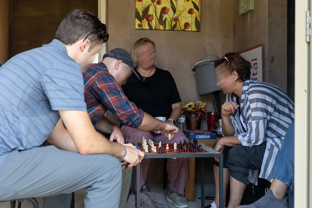 Marine Raiders, assigned to Marine Forces Special Operations Command, interact with “role-players” during the Culture Role-Play culminating event as part of the Basic Language Course