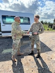 U.S. Air Force Staff Sgt. Kwame Dowdell, 125th Security Forces journeyman, greets a member of the RAF Regiment during his participation in the Military Reserve Exchange Program Sept 19, 2023. Dowdell, along with fellow 125th SFS Airmen, is participating in the Defense Department initiative that allows for Reserve and Guard forces to partner with associated units to exchange knowledge, share tactics and procedures, and understand the training, doctrine and operations of NATO partners.