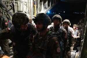 Polish soldiers assigned to the 16th Airborne Battalion, 6th Airborne Brigade, from Kraków, Poland, board a U.S. Air Force C-130J Super Hercules at the John Paul II International Airport Kraków-Balice, during Aviation Detachment Rotation 23-4, Sept. 14, 2023. ADR is a bilateral training exercise with the Polish military to enhance allied interoperability, maintain joint readiness, and assure regional allies of NATO capabilities.