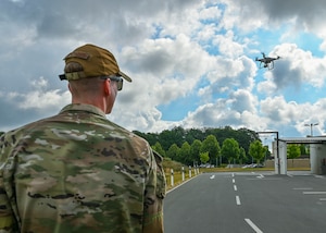 Senior Airman Ryan Hospelhorn, 52nd Security Forces Squadron small unmanned aircraft systems program manager, pilots a simulated foreign drone during a Paladin drone overview assessment, July 21, 2022, on Spangdahlem Air Base, Germany. The Paladin drone is being assessed to become another countermeasure for sUAS here at Spangdahlem. (U.S. Air Force photo by Senior Airman Jessica Sanchez-Chen)
