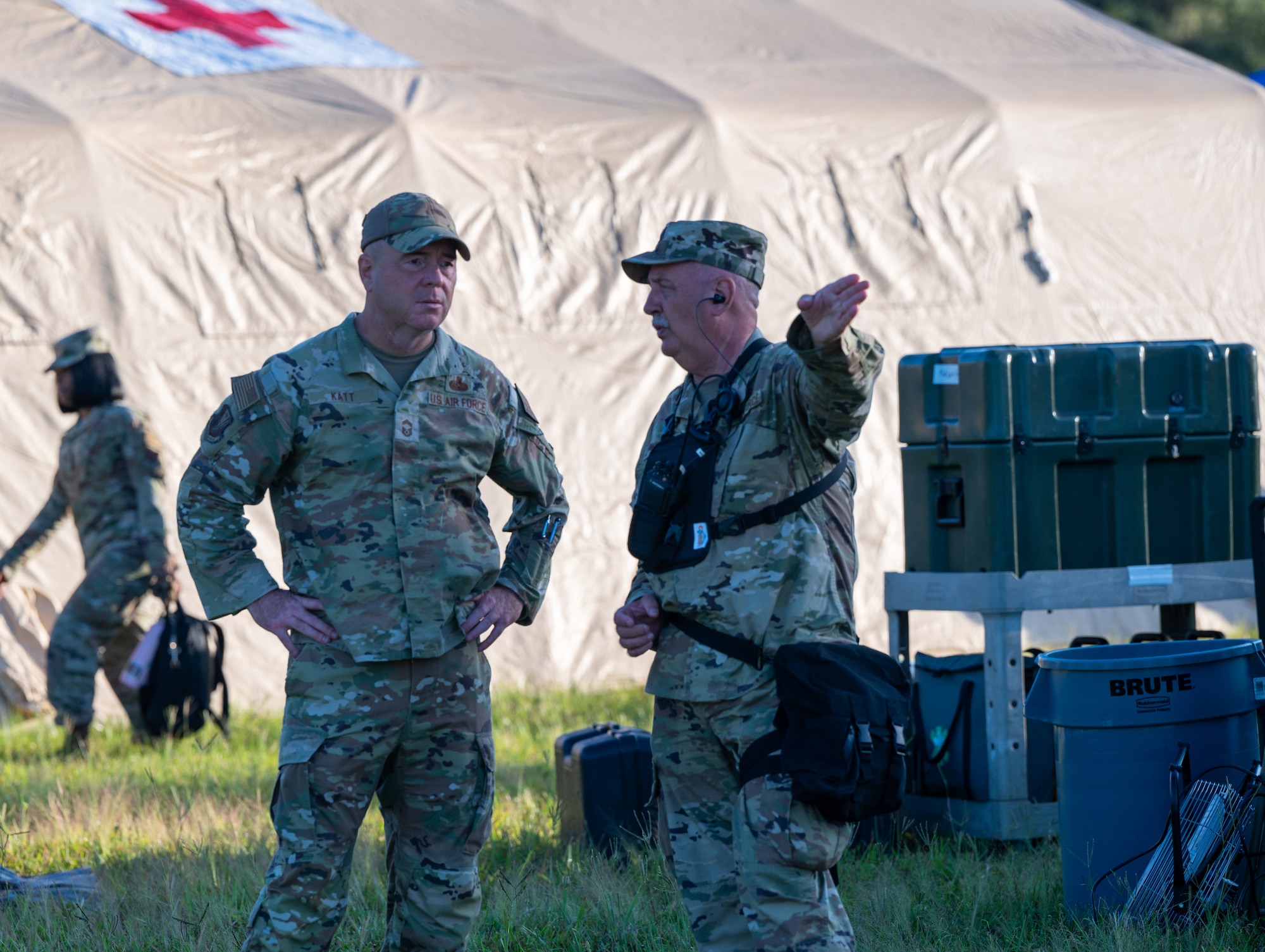 U.S. Air Force Lt. Col. Matthew Sands, 125th Medical Detachment commander and Chief Master Sgt. Thomas Katt, 125th Medical Group senior enlisted leader, pictured during a CERFP External Evaluation, Sept. 22, 2023 at Camp Blanding Joint Training Center, Florida. The CERFP, or CBRNE Enhanced Response Force Package, includes more than 200 Soldiers and Airmen from many Air and Army units who form one CERFP unit in the wake of a catastrophe. CERFP units comprise five major elements including command and control, search and extraction, decontamination, medical support, and fatality search and recovery in which teams are evaluated on their ability to immediately respond to a CBRNE incident. During the exercise, teams conducted a site search of collapsed buildings and structures, performed rescue tasks to extract trapped casualties, facilitated mass decontamination measures, performed medical triage and initial treatment to stabilize patients for transport to medical facilities, and recovered CBRN incident fatalities. Each element — CBRN, medics, decontamination, search and extraction, and FSRT (fatality, search and recovery team) — was evaluated as part of the total force response. (U.S. Air National Guard photo by Tech Sgt. Chelsea Smith)