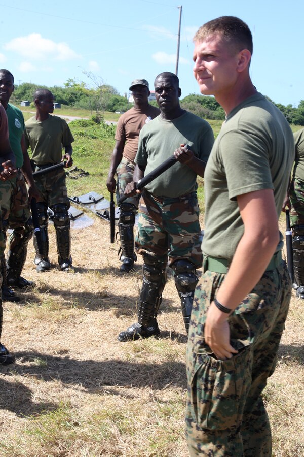 U.S. Marine Sgt. Andrew Mercer, a military policeman from Military Police Company B, Headquarters and Service Battalion, 4th Marine Logistics Group, and an Allentown, Pa. native, leads students during a crowd control practice at Barbados Defence Force Base Paragon, Christ Church, Barbados, June 18, 2012, for Exercise Tradewinds 2012. Tradewinds is a multinational, interagency exercise designed to develop and sustain relationships that improve the capacity of U.S., Canadian and 15 Caribbean partner nations security forces to counter transnational crime and provide humanitarian assistance and disaster relief.