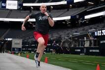 A U.S. Air Force Airman runs a 40-yard dash during the United Services Automobile Association Salute to Service Bootcamp at Allegiant Stadium, Las Vegas, Nevada, Sept. 19, 2023.