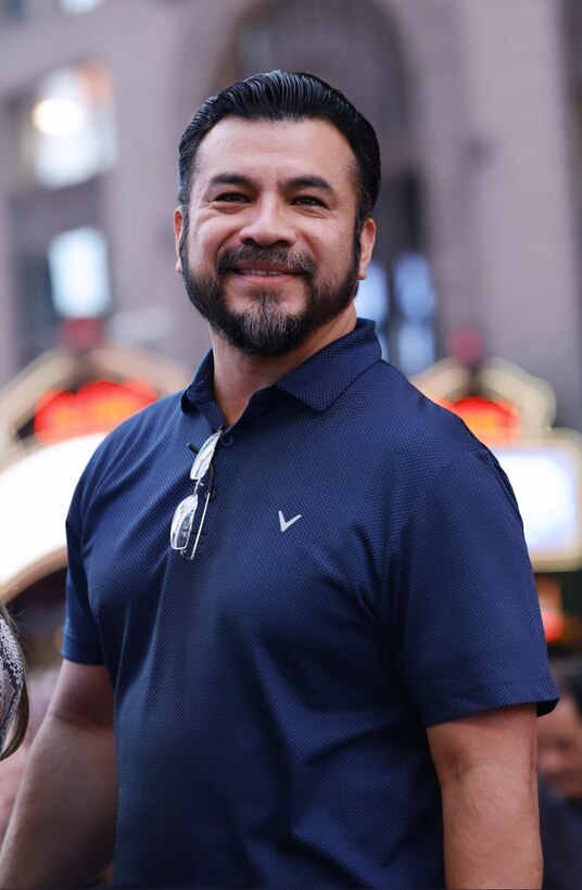 Silvino Gonzalez, a bearded Hispanic man wearing a blue polo shirt