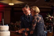 U.S. Air Force Airman 1st Class Kaelon Duke, left, a 99th Civil Engineer Squadron emergency manager, and retired U.S. Air Force Gen. Lori Robinson, the former commander of United States Northern Command, cut the cake during the Air Force Ball in Las Vegas, Nevada, Sept. 16, 2023.