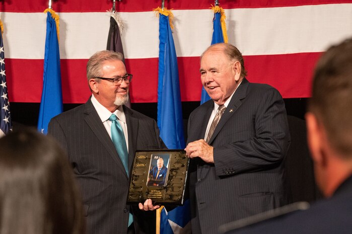 David Radcliffe, left, the Nellis Support Team president, awards Michael Gaughan, the owner of South Point Hotel, Casino and Spa, the Civic Leader Lifetime Achievement Award at South Point Hotel Casino and Spa in Las Vegas, Nevada, Sept. 16, 2023.