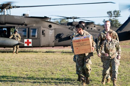 A group of Soldiers with the 144th Area Support Medical Company, Utah Army National Guard, perform a blood exchange so they can have fresh blood for potential patients participating in Talisman Sabre, Camp Rocky, Rockhampton, Australia, July 30, 2023. Talisman Sabre is a large-scale, bilateral military exercise between Australia and the United States, which strengthens relationships and interoperability among key allies and enhances collective capabilities to respond to a wide array of potential security concerns. This will be the 10th iteration of the exercise. (Sgt. Alejandro Lucero)