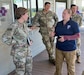 April Bruce, right, lead system technical representative with U.S. Army Medical Logistics Command, briefs Maj. Gen. Paula Lodi, commanding general of 18th Medical Command, on the Logistics Assistance Program during a site visit to Talisman Sabre 23 in Australia. (Courtesy)