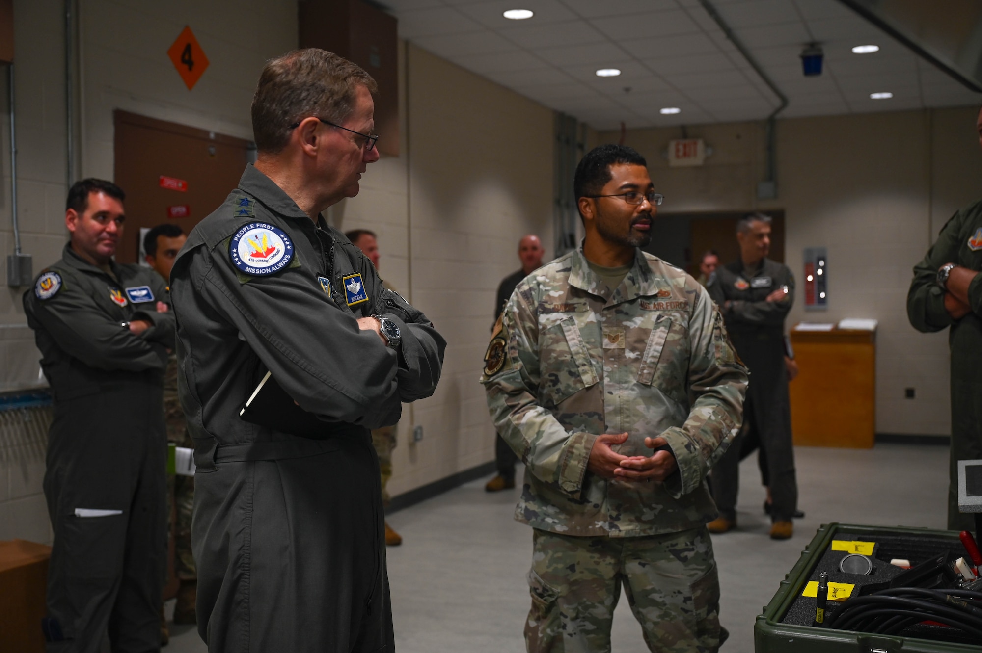 U.S. Air Force Lt. Gen. Russ Mack, deputy commander of Air Combat Command, receives a brief from Tech. Sgt. Reginald Davis, 87th Electronic Warfare Squadron COMBAT SHIELD avionics electronic warfare (EW) journeyman, on the mission of COMBAT SHIELD during a visit to the 350th Spectrum Warfare Wing at Eglin Air Force Base, Fla., Sept. 6, 2023. COMBAT SHIELD is the lead U.S. Air Force EW assessment program and is responsible for advising all MAJCOM-specific EW assessment programs. (U.S. Air Force photo by Capt. Benjamin Aronson)