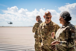 Woman having a discussion with a man.