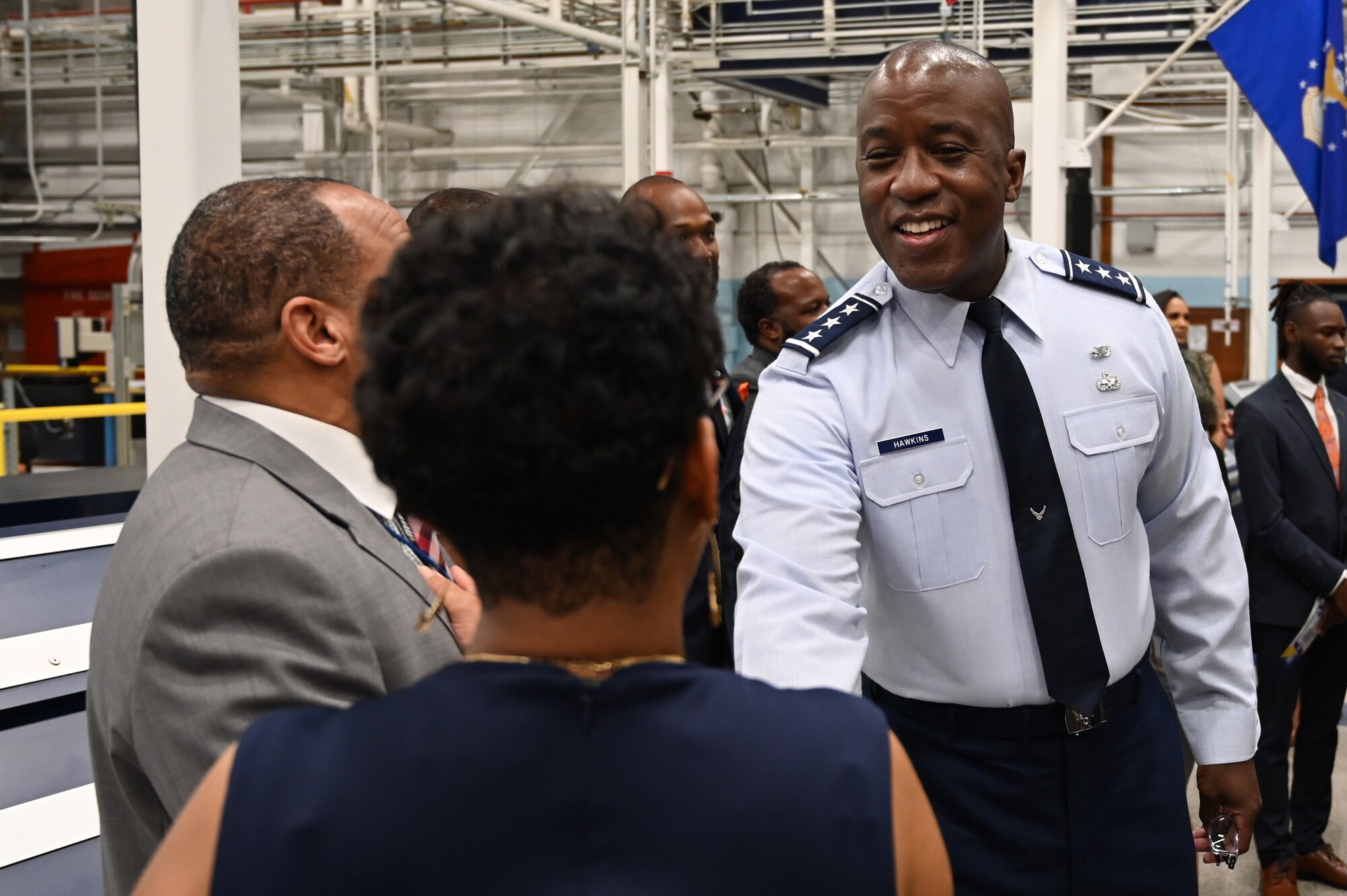 U.S. Air Force Lt. Gen. Stacey T. Hawkins, Air Force Sustainment Center commander, speaks with guests after a ground-breaking agreement was brokered on Sept. 25.