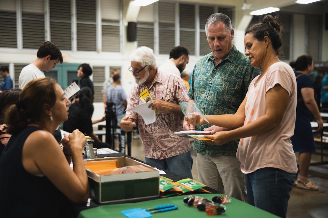 Lance Bookless, senior natural resources manager for Marine Corps Base Hawaii, speaks with community members during an Invasive Species Management Town Hall, Waimanalo, Hawaii, Aug. 21, 2023. The meeting was held to discuss current invasive species threats, preventative and eradication efforts in coordination with various government stakeholders, farmers, and businesses, as well as community groups and members. (U.S. Marine Corps photo by Cpl. Brandon Aultman)