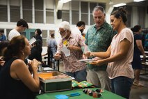 Lance Bookless, senior natural resources manager for Marine Corps Base Hawaii, speaks with community members during an Invasive Species Management Town Hall, Waimanalo, Hawaii, Aug. 21, 2023. The meeting was held to discuss current invasive species threats, preventative and eradication efforts in coordination with various government stakeholders, farmers, and businesses, as well as community groups and members. (U.S. Marine Corps photo by Cpl. Brandon Aultman)