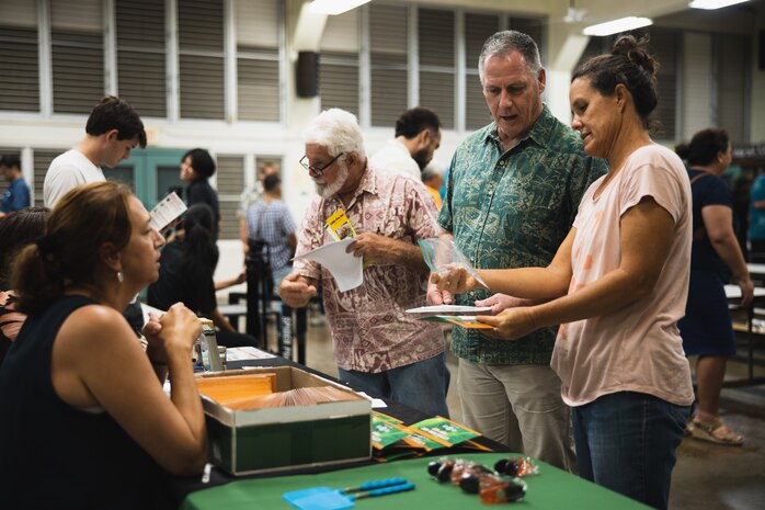 Lance Bookless, senior natural resources manager for Marine Corps Base Hawaii, speaks with community members during an Invasive Species Management Town Hall, Waimanalo, Hawaii, Aug. 21, 2023. The meeting was held to discuss current invasive species threats, preventative and eradication efforts in coordination with various government stakeholders, farmers, and businesses, as well as community groups and members. (U.S. Marine Corps photo by Cpl. Brandon Aultman)