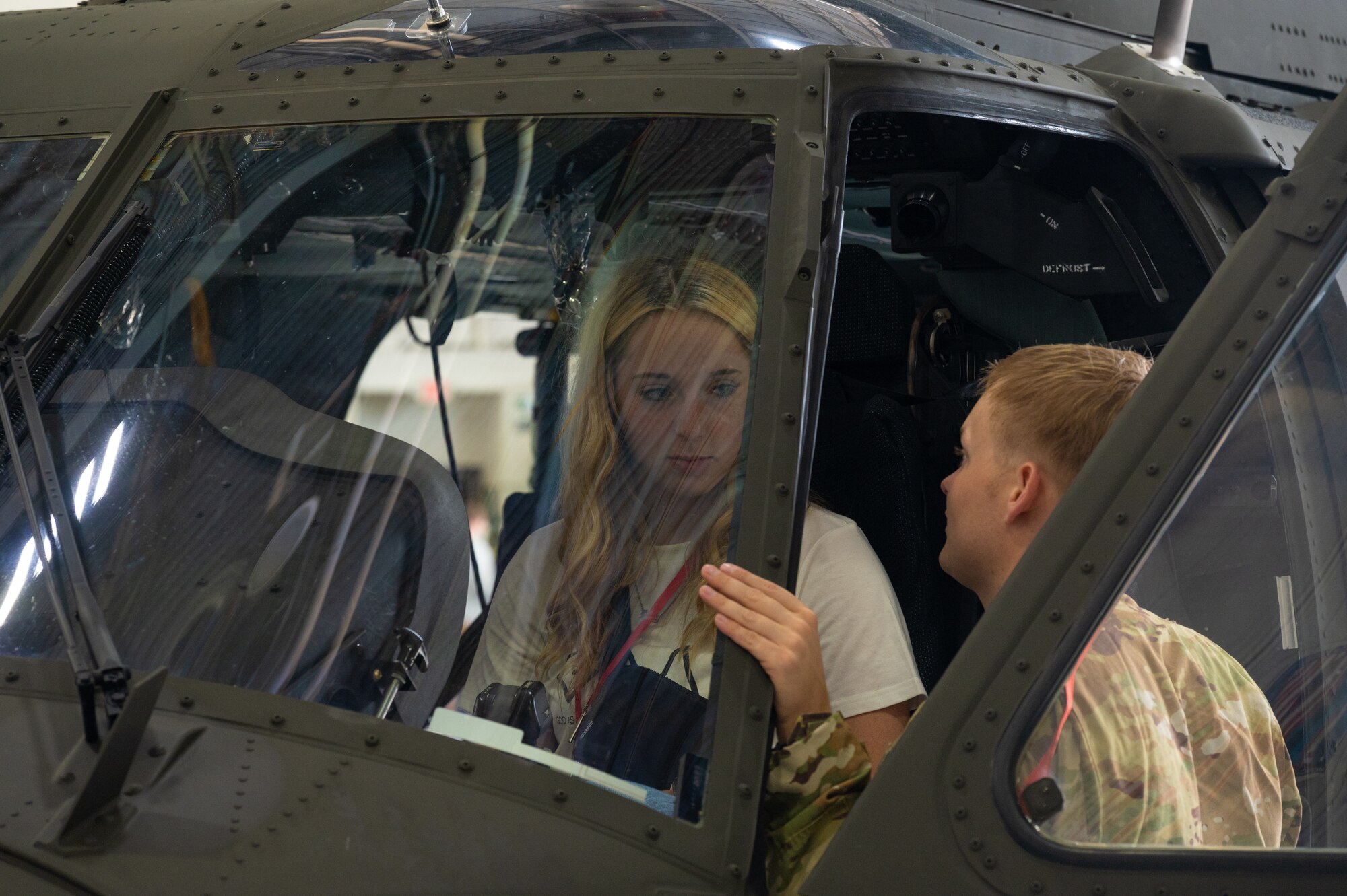 Natalie Clutter, Smithon High School senior, speaks with a U.S. Army soldier at Whiteman Air Force Base, Mo., Sept. 22, 2023. The career fair was intended to inform and provide a first hand experience for students to see what the U.S. Air Force does on a daily basis. (U.S. Air Force photo taken by Airman 1st Class Joseph Garcia)