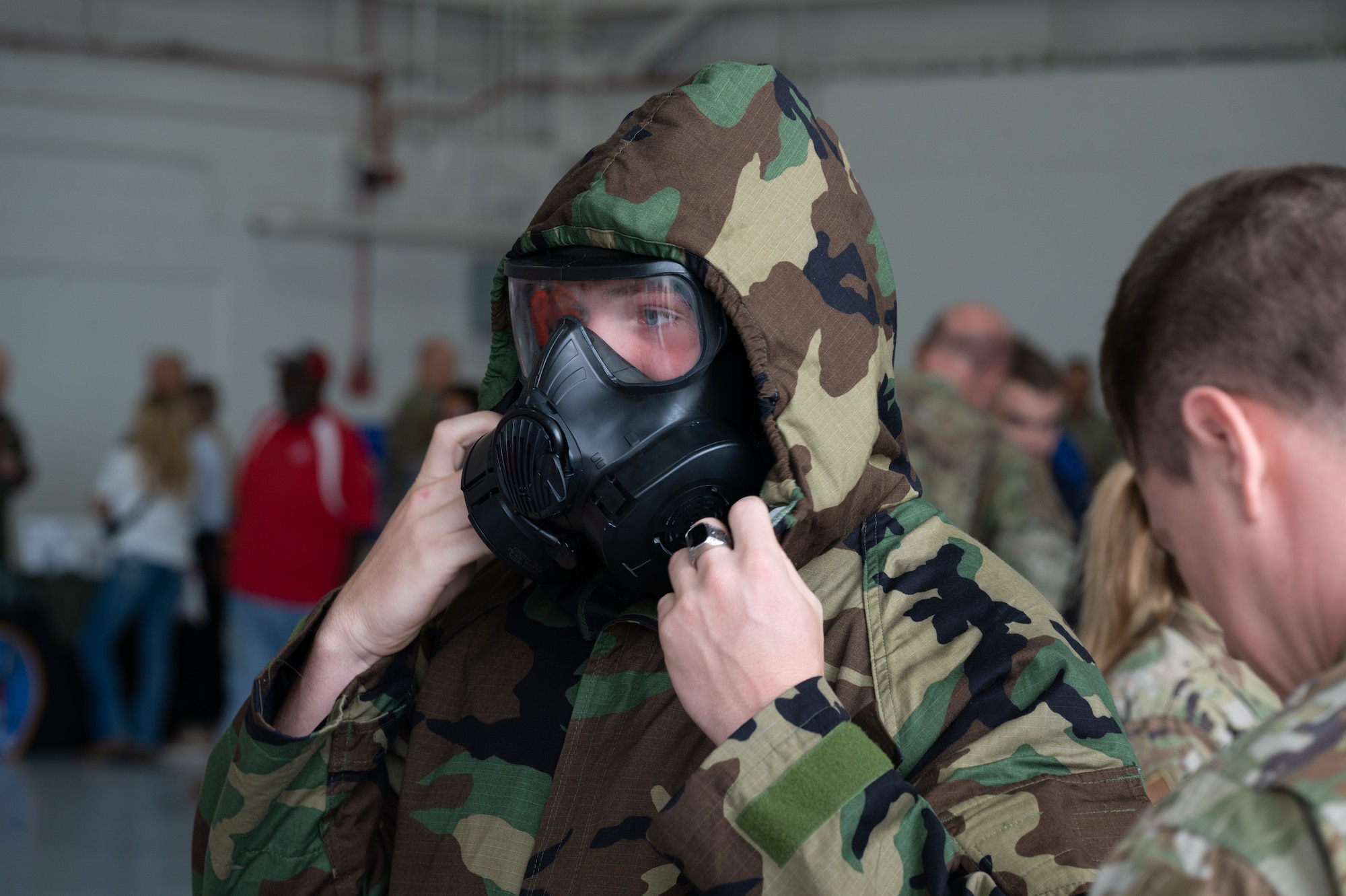 Eligah Brown, Knox County High School senior, tries on Mission Oriented Protective Posture equipment at Whiteman Air Force Base, Mo., Sept. 22, 2023. The career fair was intended to inform and provide a first hand experience for students to see what the U.S. Air Force does on a daily basis. (U.S. Air Force photo taken by Airman 1st Class Joseph Garcia)