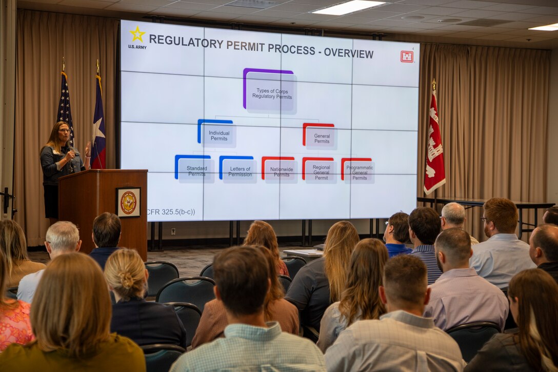 Marie Taylor (podium), U.S. Army Corps of Engineers (USACE) Galveston District's central evaluation unit leader, gives an overview of the district's regulatory permit process during a public outreach workshop, September 21, 2023. The event—open to the public—was held at the district’s headquarters and included presentations from regulatory specialists on a variety of topics centering on USACE’s regulatory and permitting programs.