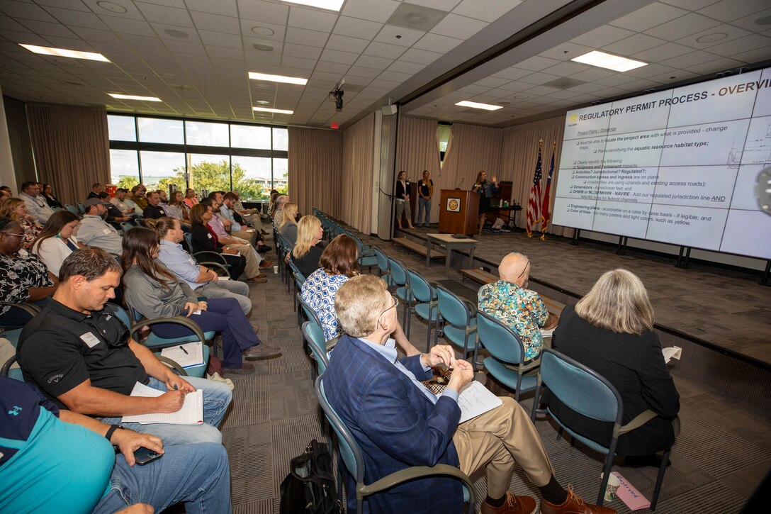 Marie Taylor (podium), U.S. Army Corps of Engineers (USACE) Galveston District's central evaluation unit leader, gives an overview of the district's regulatory permit process during a public outreach workshop, September 21, 2023. The Army’s Regulatory Program is one of the oldest in the U.S. federal government. Initially, it served to protect and maintain the navigable capacity of the nation’s waters. Time, changing public needs, evolving policy, case law, and new statutory mandates have changed the complexity of the program.