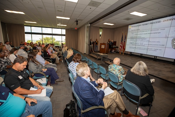 Marie Taylor (podium), U.S. Army Corps of Engineers (USACE) Galveston District's central evaluation unit leader, gives an overview of the district's regulatory permit process during a public outreach workshop, September 21, 2023. The Army’s Regulatory Program is one of the oldest in the U.S. federal government. Initially, it served to protect and maintain the navigable capacity of the nation’s waters. Time, changing public needs, evolving policy, case law, and new statutory mandates have changed the complexity of the program.