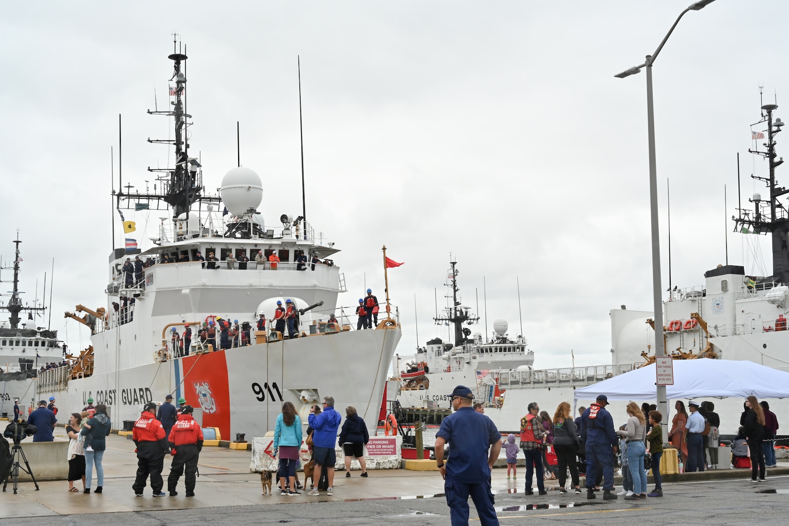 A crowd waits to greet U.S. Coast Guard Cutter Forward's (WMEC 911) crew at the pier, Sept. 26, in Portsmouth, Virginia. Forward completed a two-and-a-half month-long patrol in the North Atlantic Ocean to support the Coast Guard Arctic Strategy and participate in the Canadian Armed Forces-led Operation Nanook 2023, an annual military exercise conducted to strengthen shared maritime objectives in the high northern latitudes. (U.S. Coast Guard photo by Petty Officer 2nd Class Brandon Hillard)