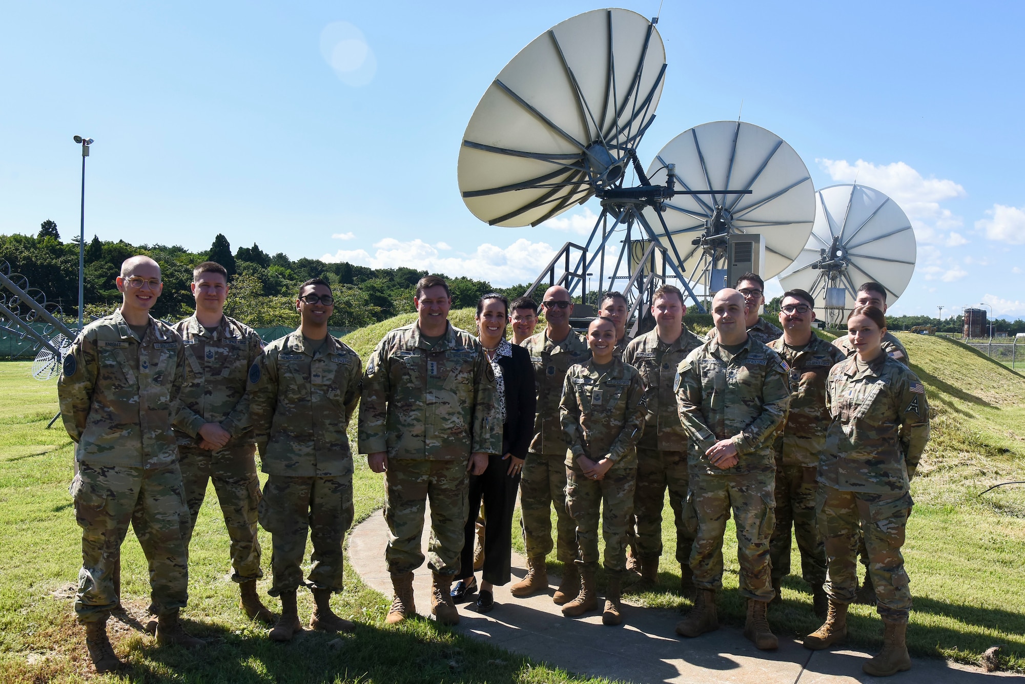 A group of military members stand together for a picture.