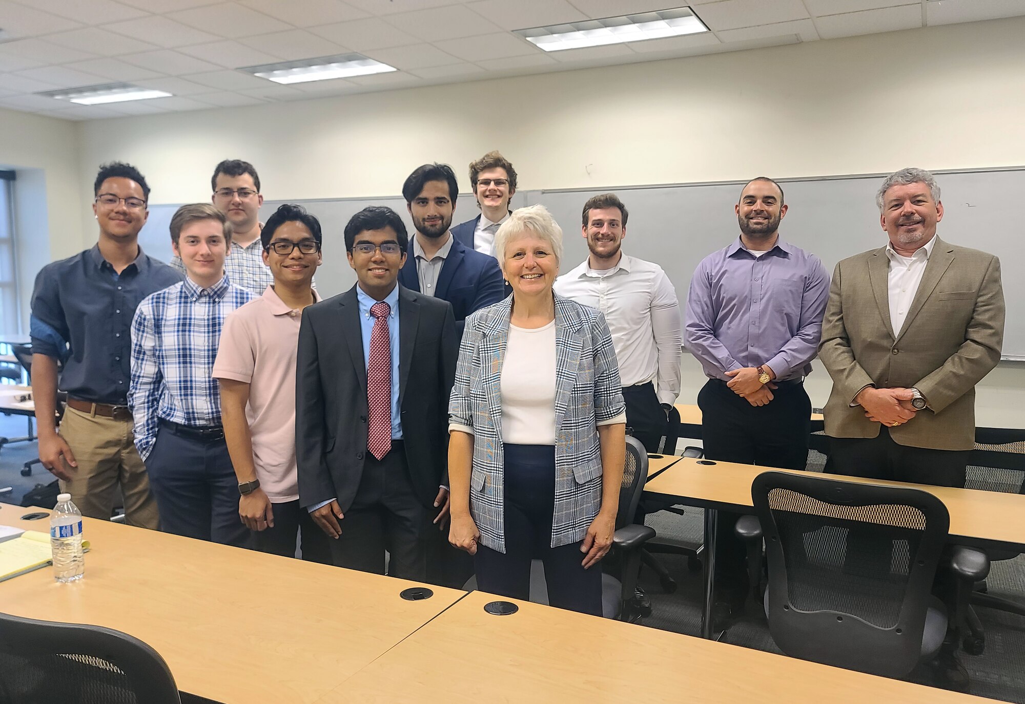 The Air Force Institute of Technology hosted ten undergraduate interns as part of the University Consortium for Applied Hypersonics summer program. At the end of the program, the interns presented their research projects to internship sponsors, Dr. Lori Stiglitz and Matt Akers from the Joint Hypersonics Transition Office. (U.S. Air Force photo by Chelsey Cathey)