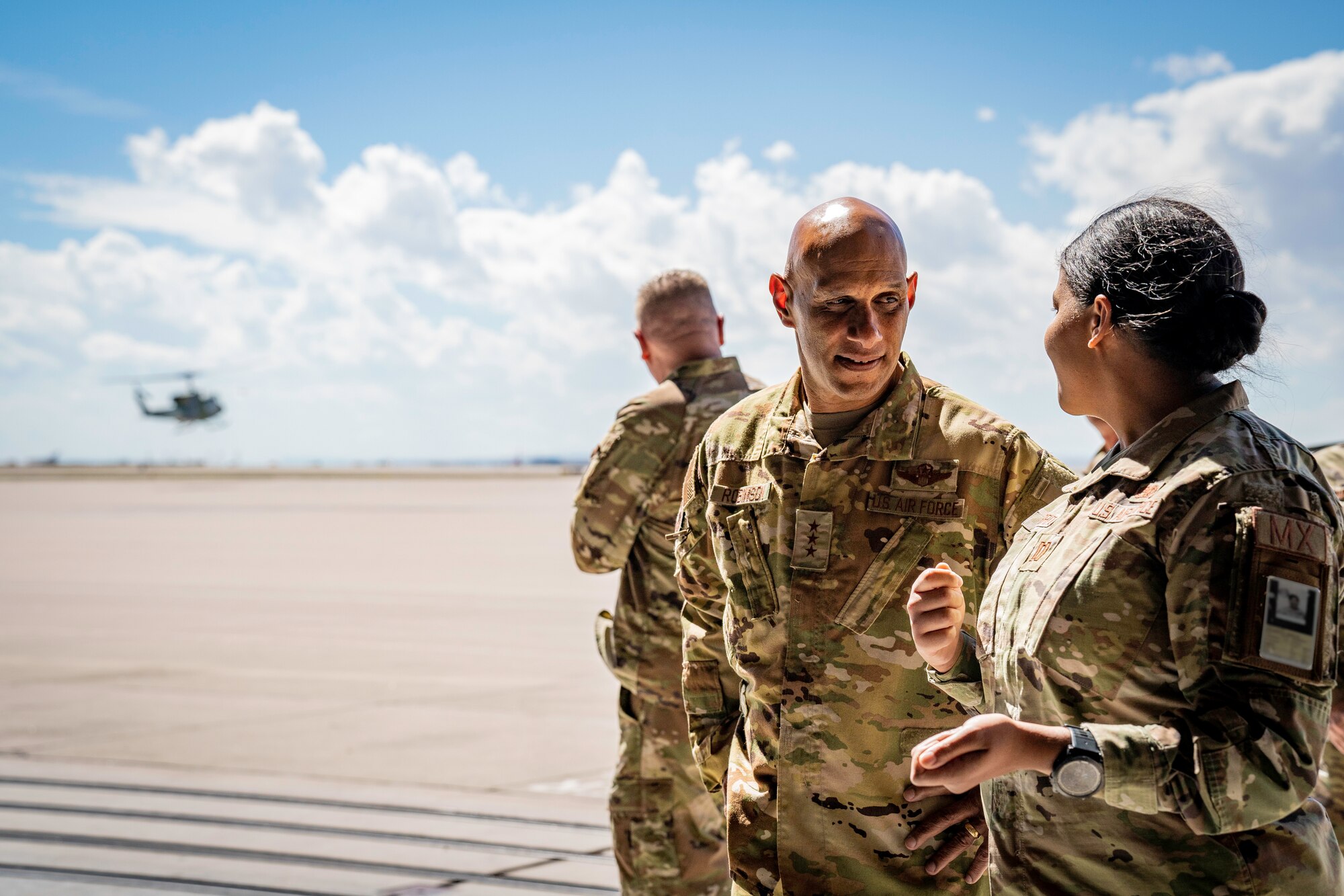 Woman having a discussion with a man.