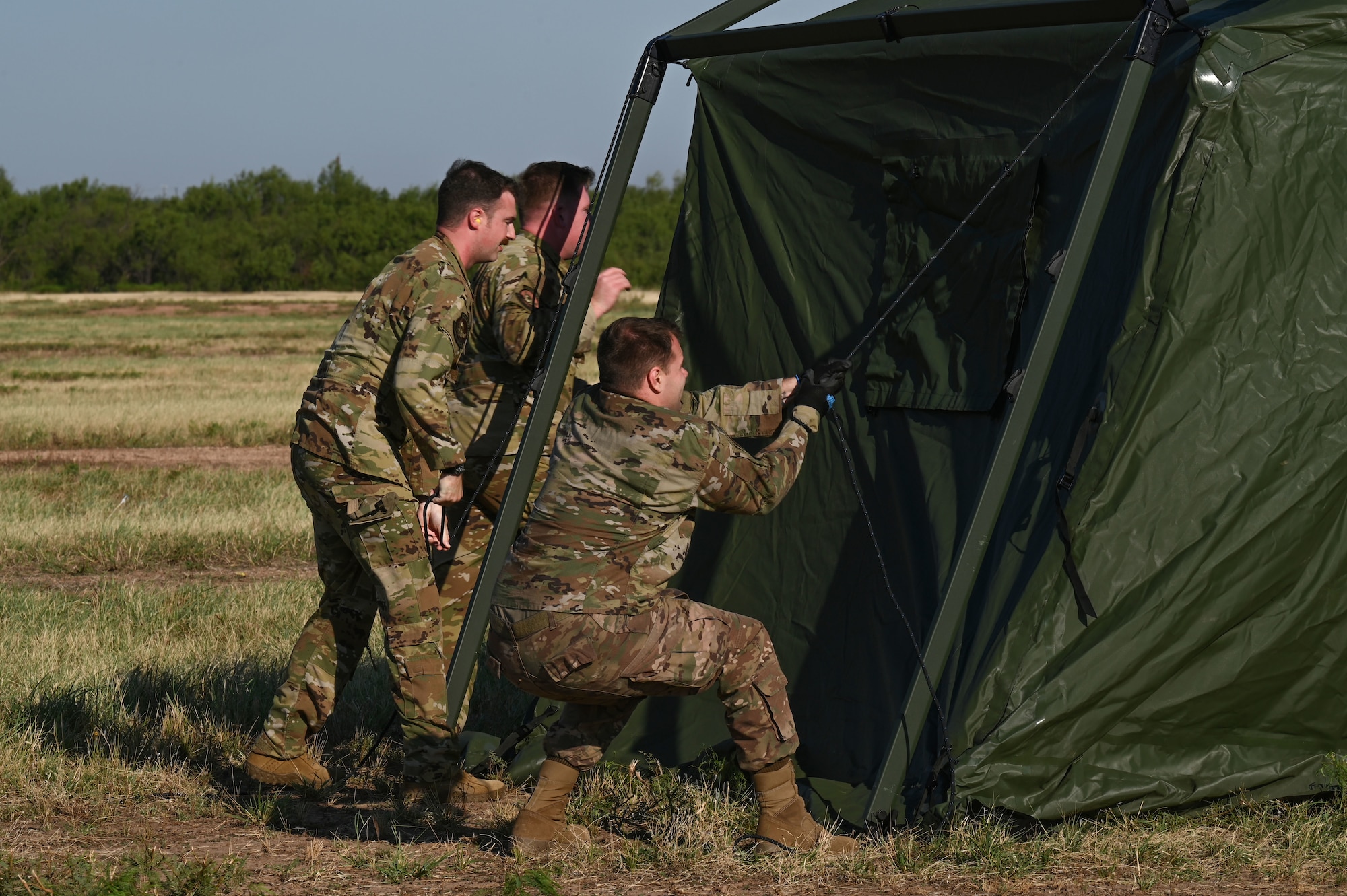 Airmen from the 317th Airlift Wing set up tents for the Tactical Operating Center at Dyess Air Force Base, Texas, Sept. 19, 2023. The TOC is designed for use in areas where established operating centers may not be available. (U.S. Air Force photo by Senior Airman Sophia Robello)