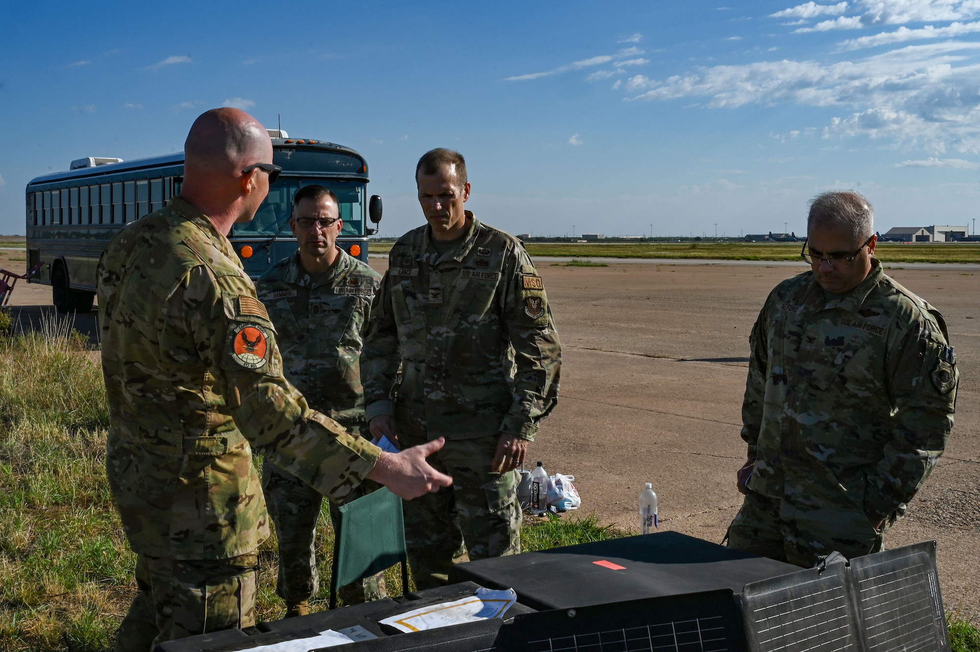 Maj. Lucas Walker, 39th Airlift Squadron weapons officer, explains the significance of the demonstration to leadership at Dyess Air Force Base, Texas, Sept. 19, 2023. This demonstration showcased agile combat employment operations that can be used against near-peer adversaries. (U.S. Air Force photo by Senior Airman Sophia Robello)