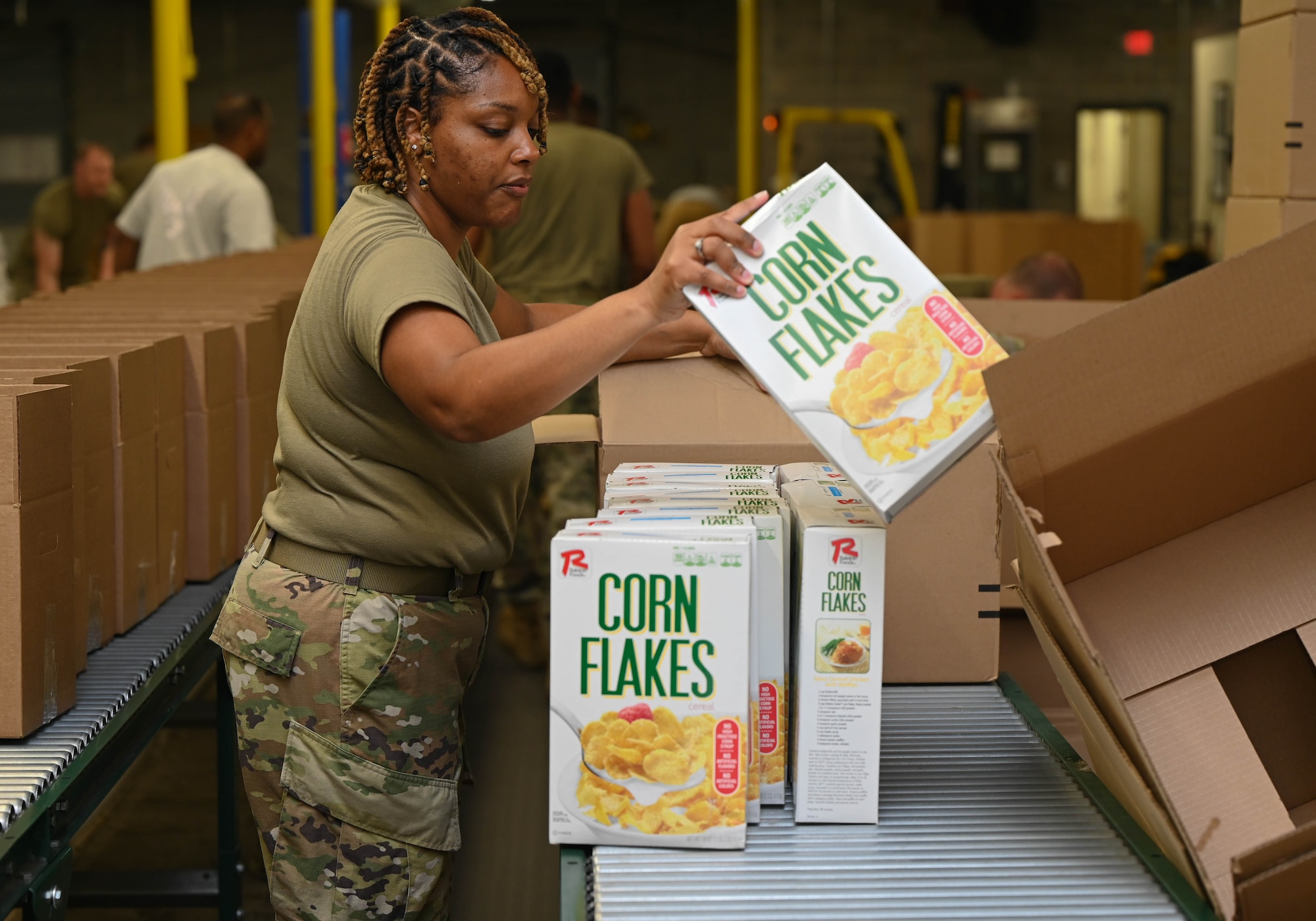 a woman packs a box of food