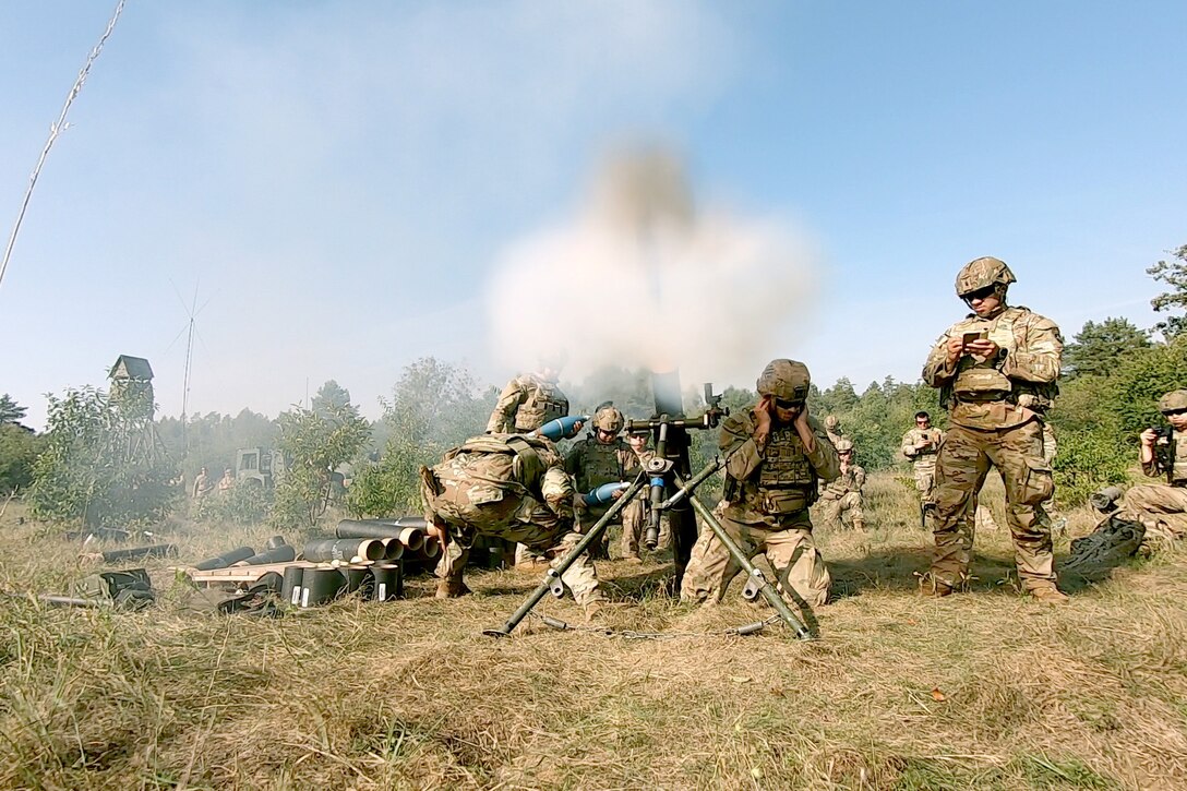 Soldiers participate in a mortar live-fire exercise.