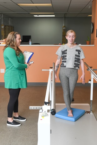 Physical Therapy Assistant Sarah Ducatte (left) cares for a physical therapy patient at the Intrepid Spirit Center at Camp Lejeune. 

On Oct. 2, 2023, the specialty clinic will celebrate 10 years of care for those with traumatic brain injuries or TBI-related ailments.
