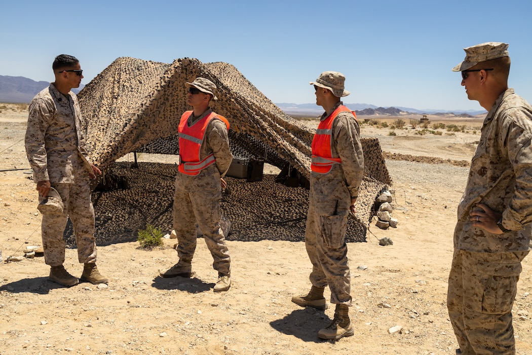 U.S. Marine Corps Sgt. Maj. Carlos A. Ruiz, Sergeant Major of Marine Forces Reserve and Marine Forces South, talks to Marines attached with Military Police Company Charlie, 4th Law Enforcement Battalion, Force Headquarters Group, Marine Forces Reserve, at Marine Corps Air-Ground Combat Center Twentynine Palms, California, as part of Integrated Training Exercise 4-23, June 24, 2023. As the Marine Corps Reserve’s premier annual training event, ITX provides opportunities to mobilize geographically dispersed forces for a deployment; increase combat readiness and lethality; and exercise MAGTF command and control of battalions and squadrons across the full spectrum of warfare.(U.S. Marine Corps photo by. Cpl. Ryan Schmid)