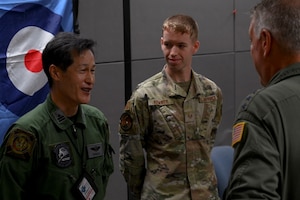 (Right) U.S. Air Force Gen. Mike Minihan, commander of Air Mobility Command, speaks with various mission planners from numerous countries participating in MOBILITY GUARDIAN 2023 at Andersen Air Force Base, Guam, July 8, 2023. Minihan recognized outstanding performers and discussed the different roles each participant played in the exercise and the overall outcome. Staff Sgt. Noah Kemner (center), Japanese Language Enabled Airman Program Scholar, provided language support. (U.S. Air Force photo by Tech. Sgt. Tabatha Arellano)