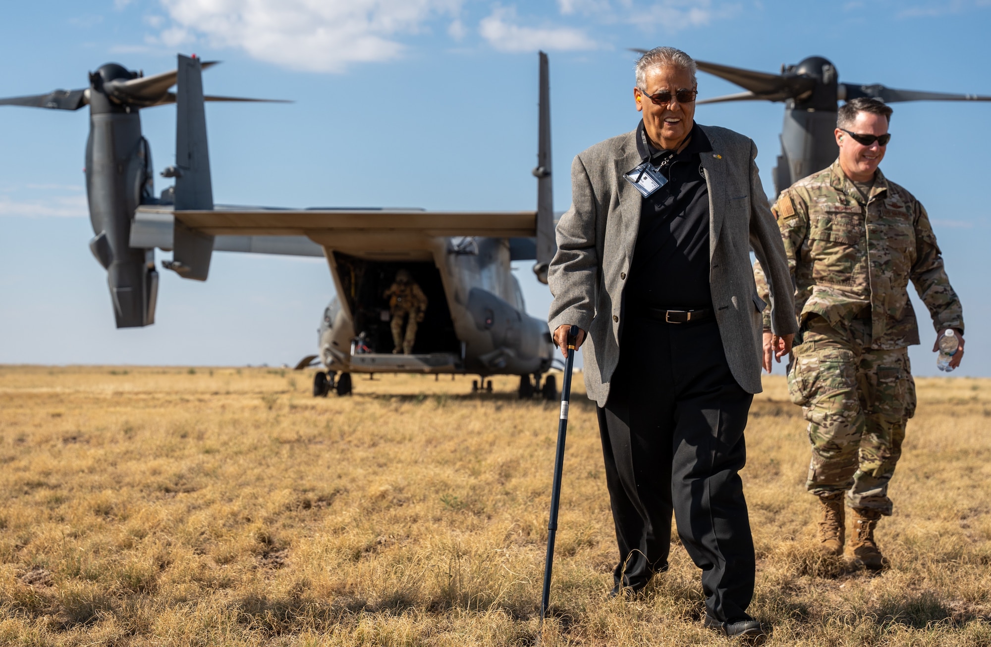 Two members depart a CV-22 at Melrose Air Force Range.