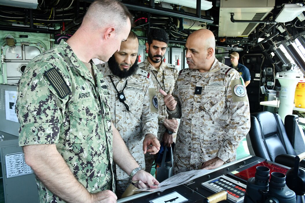 Royal Saudi Navy Commodore Saleh Aloufi, right, visits USS Indianapolis (LCS 17) in Manama, Bahrain.