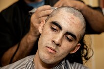 U.S. Marine Corps Recruit Marcus Duarte, with Lima Company, 3rd Recruit Training Battalion, receives a haircut during receiving at Marine Corps Recruit Depot San Diego, Sept. 25, 2023. Receiving is the first event during recruit training where recruits are checked for contraband, given a haircut, issued gear and make a phone call home. Duarte was recruited out of San Jose, Calif. (U.S. Marine Corps photo by Sgt. Yvonna Guyette)