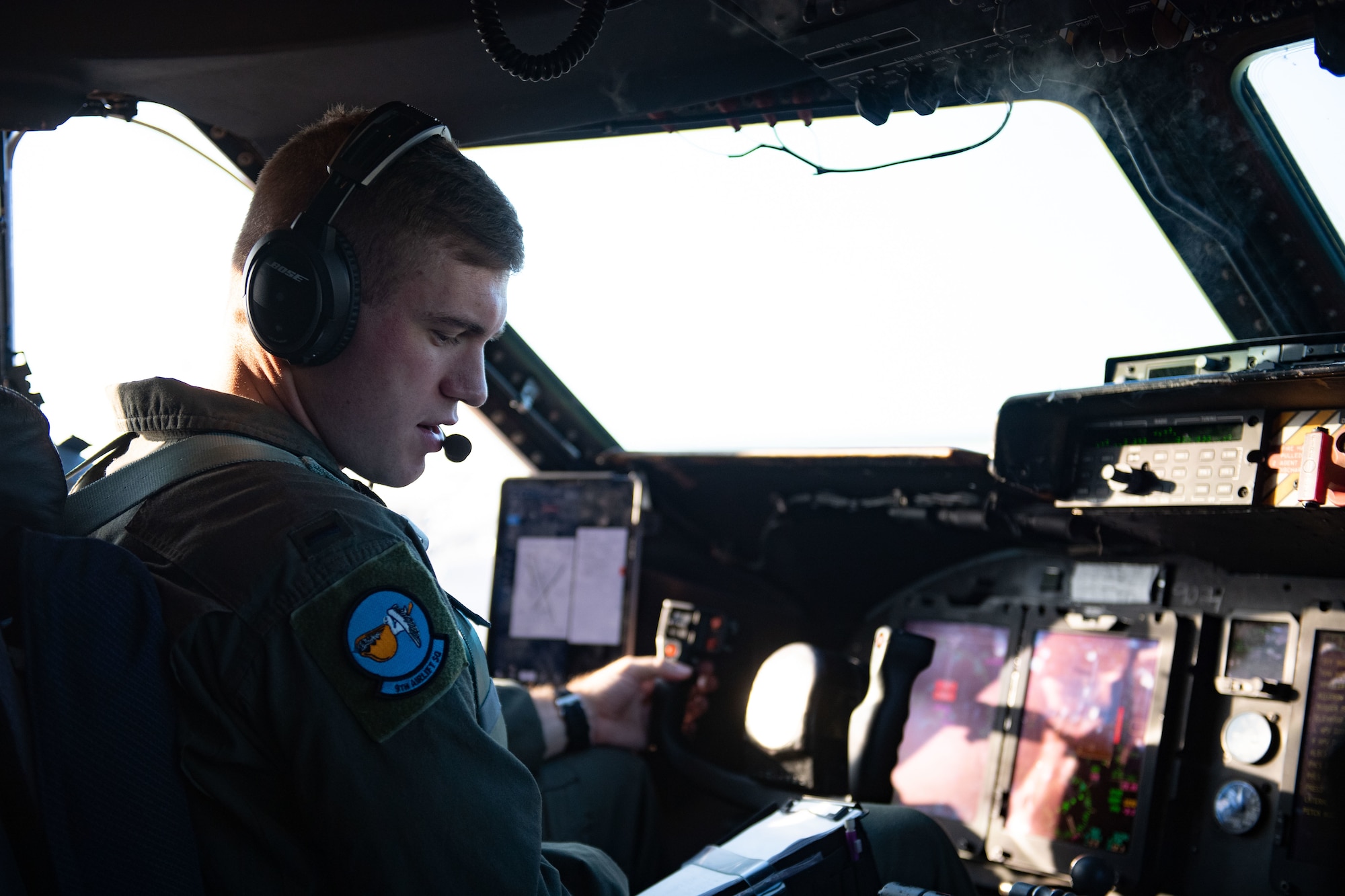 U.S. Air Force 1st Lt. Evan Wilfong, 9th Airlift Squadron pilot, listens for taxi clearance from air traffic control during Exercise Castaway 23-3 at Dover Air Force Base, Delaware, Sept. 6, 2023. Castaway 23-3 was a Total Force, Interagency training exercise designed to train and update local search and rescue procedures. (U.S. Air Force photo by 1st Lt. Trevor Wood)