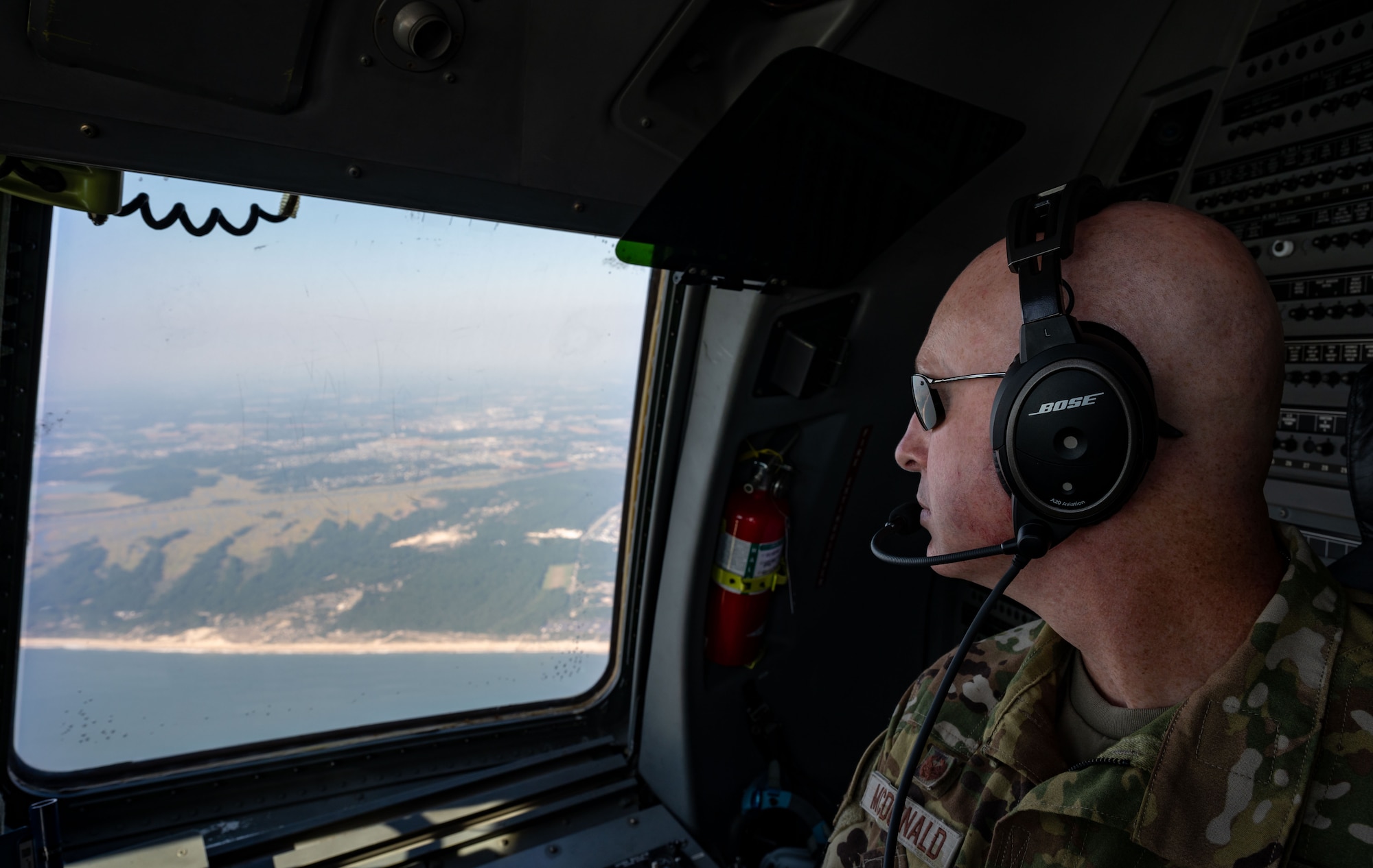 U.S. Air Force Col. Chris McDonald, 436th Airlift Wing commander, searches for a life raft during Exercise Castaway 23-3 off the coast of Cape Henlopen, Delaware, Sept. 6, 2023. Castaway 23-3 was a Total Force, Interagency training exercise designed to train and update local search and rescue procedures. (U.S. Air Force photo by Airman 1st Class Amanda Jett)