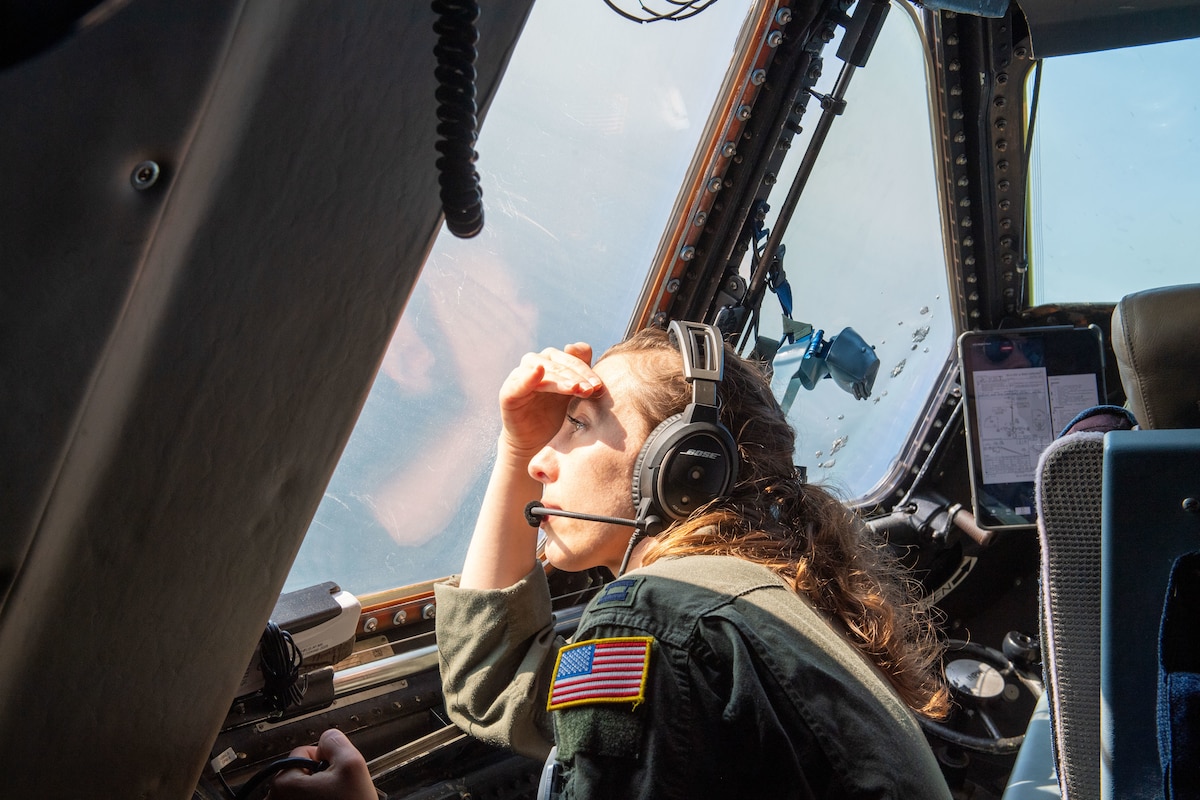 U.S. Air Force Capt. Sara Proctor, 9th Airlift Squadron pilot, searches for a life raft from the cockpit of a U.S. Air Force C-5M Super Galaxy during Exercise Castaway 23-3 near Indian River Inlet, Delaware, Sept. 6, 2023. Castaway 23-3 was a Total Force, Interagency training exercise designed to train and update local search and rescue procedures. (U.S. Air Force photo by 1st Lt. Trevor Wood)