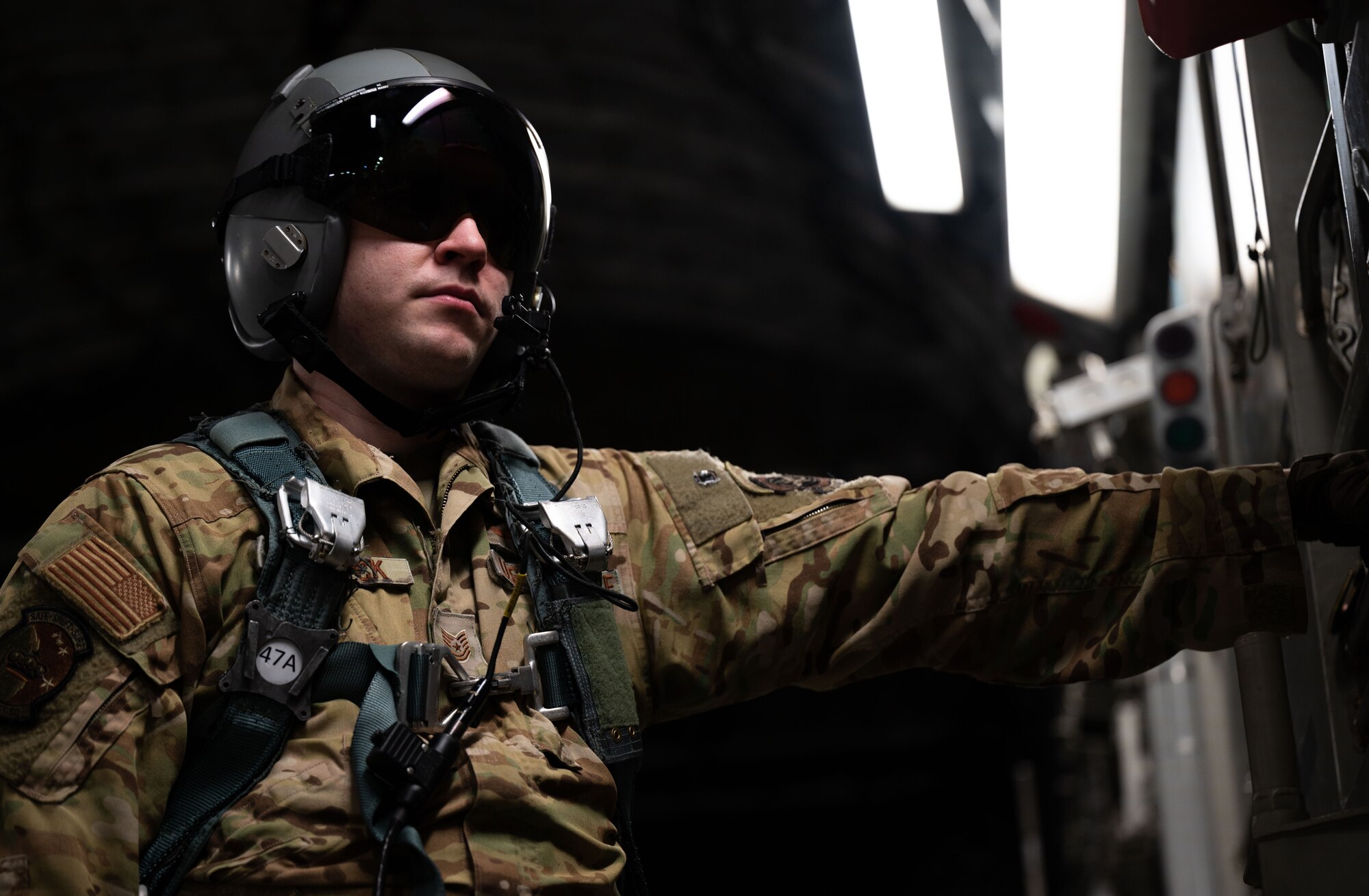 U.S. Air Force Tech. Sgt. Cody Deranick, 3rd Airlift Squadron loadmaster, prepares to open the back of a U.S. Air Force C-17 Globemaster III during Exercise Castaway 23-3 near Indian River Inlet, Delaware, Sept. 6, 2023. Castaway was a Total Force, Interagency training exercise designed to train and update local search and rescue procedures. (U.S. Air Force photo by Airman 1st Class Amanda Jett)