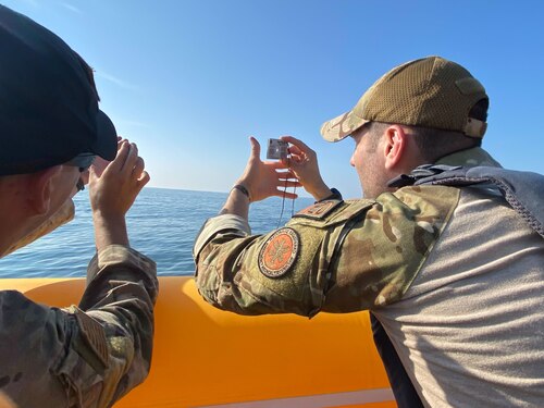 U.S. Air Force Staff Sgt. Max Robichaud, 436th Healthcare Operations Squadron noncommissioned officer in charge of ambulance services, uses a signaling mirror during Exercise Castaway 23-3 near Indian River Inlet, Delaware, Sept. 6, 2023. Castaway 23-3 was a Total Force, Interagency training exercise designed to train and update local search and rescue procedures. (U.S. Air Force photo by Airman 1st Class Dieondiere Jefferies)