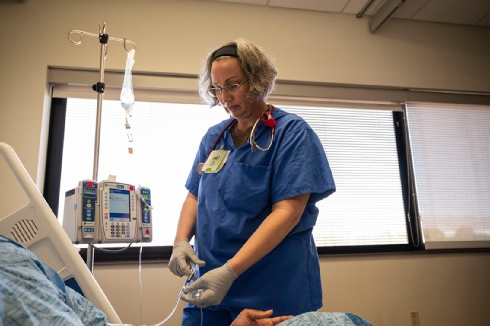 U.S. Air Force Capt. Nakia Halcomb, a registered nurse assigned to the 56th Operational Medical Readiness Squadron, Luke Air Force Base, Ariz., administers medicine to a patient at Nellis Air Force Base, Nevada, Aug. 24, 2023. The 99th Medical Group’s Currency Training Program provides U.S. Air Force medical personnel with the training and skill set needed for adequate and efficient care down range.