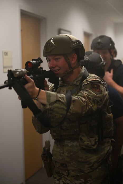 U.S. Air Force Airman Alex Johnson, 17th Security Forces Squadron defender, participates in a training exercise meant to simulate room clearing in a situation where both EMS and Security Forces are present during the Rescue Task Force course of the Threat Suppression Inc. exercise, Goodfellow Air Force Base, Texas, Sep. 21, 2023. Members of the 17th SFS, the 17th Civil Engineering Squadron fire department, and local Tom Green County Sheriff's Office officers participated in a week of classroom and practical exercises to prepare them for real world scenarios. (U.S. Air Force photo by Airman 1st Class Madison Collier)