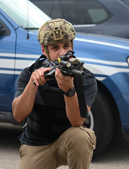 Robert Madrid, 17th Security Forces Squadron investigator, participates in the final training simulation during the Rescue Task Force course of the Threat Suppression Inc. exercise, Goodfellow Air Force Base, Texas, Sep. 21, 2023. The course is designed with “round robin” training groups who teach participants active shooter exercises and responses to multiple active shooter events. Members of the 17th SFS, the 17th Civil Engineering Squadron fire department, and local Tom Green County Sheriff's Office officers participated in a week of classroom and practical exercises to prepare them for real world scenarios. (U.S. Air Force photo by Airman 1st Class Madison Collier)