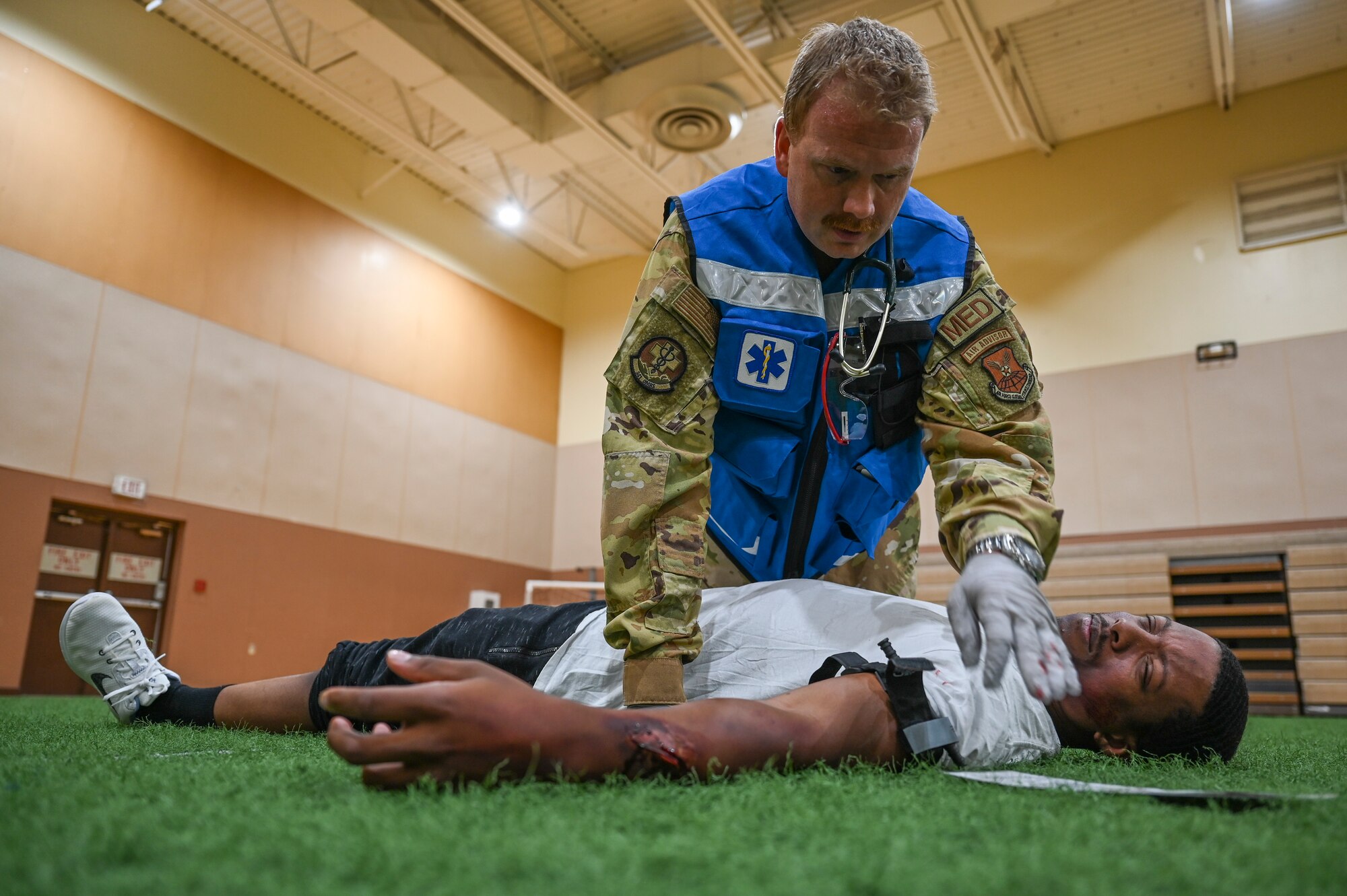 An Airman from the 341st Medical Group treats a simulated casualty during Ready EAGLE II, a training exercise held biennially at Malmstrom Air Force Base, Mont., Sept. 21, 2023. Prior to the exercise, the Ready EAGLE II contractor provided hands-on training and tabletop exercise for 341 MDG’s command, field response and decontamination teams. (U.S. Air Force photo by Senior Airman Breanna Christopher Volkmar)