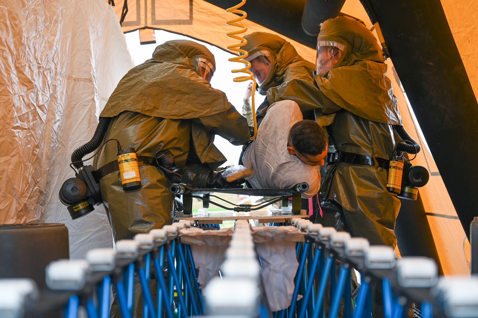 Medical Airmen from the 341st Medical Group decontaminate a simulated casualty during Ready EAGLE II, a training exercise held biennially at Malmstrom Air Force Base, Mont., Sept. 21, 2023. Ready EAGLE II is a medical readiness contract providing training on triage, decontamination, treatment and patient tracking skills. (U.S. Air Force photo by Senior Airman Breanna Christopher Volkmar)
