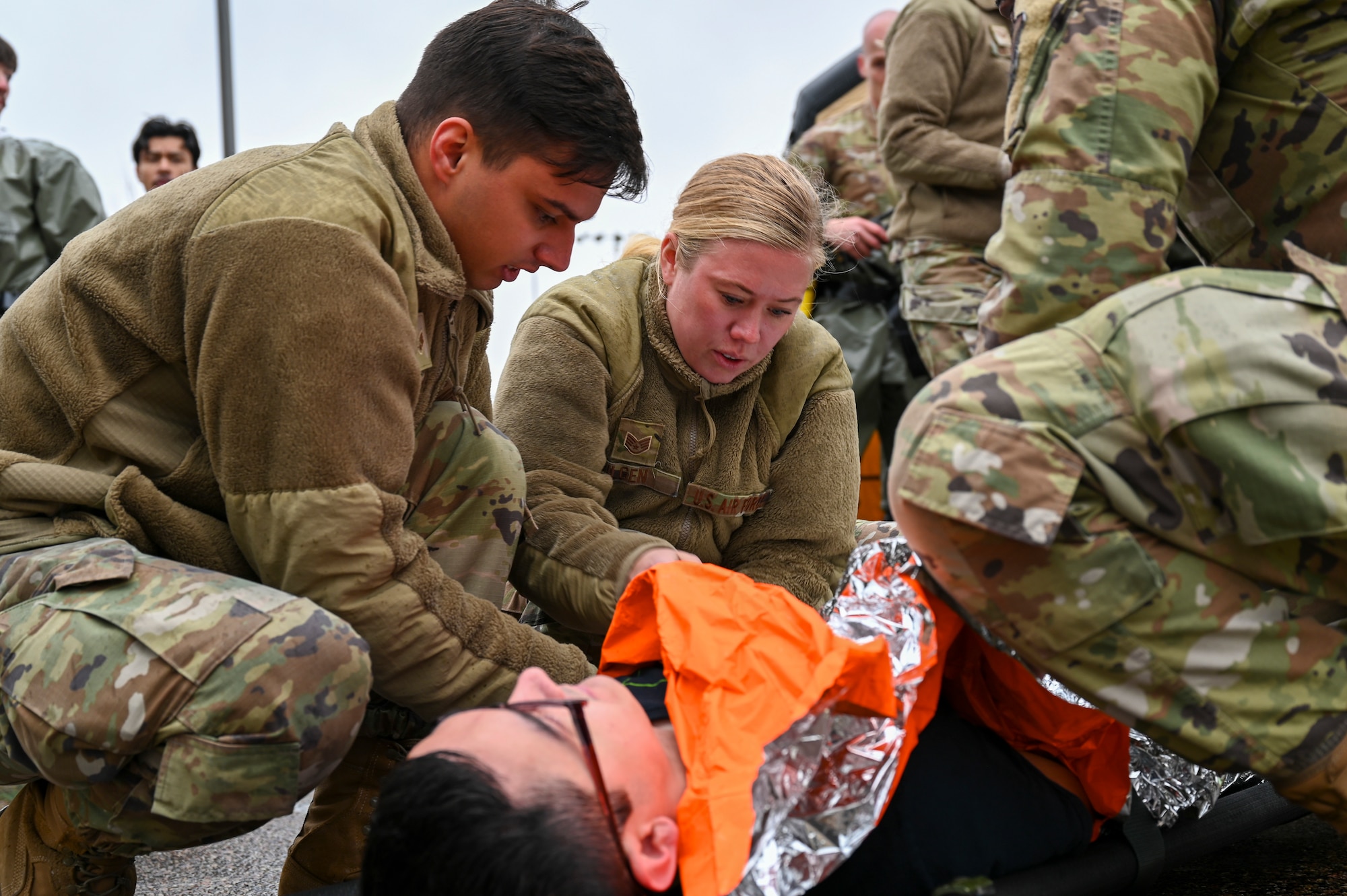 Airmen from the 341st Medical Group prepare to transport a simulated casualty during Ready EAGLE II, a training exercise held biennially at Malmstrom Air Force Base, Mont., Sept. 21, 2023. The training included a response to a chemical, biological, radiological and nuclear disaster allowing the medics to train their triage, decontamination, treatment and patient tracking skills on roughly 60 volunteer actors. (U.S. Air Force photo by Senior Airman Breanna Christopher Volkmar)