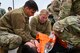Airmen from the 341st Medical Group prepare to transport a simulated casualty during Ready EAGLE II, a training exercise held biennially at Malmstrom Air Force Base, Mont., Sept. 21, 2023. The training included a response to a chemical, biological, radiological and nuclear disaster allowing the medics to train their triage, decontamination, treatment and patient tracking skills on roughly 60 volunteer actors. (U.S. Air Force photo by Senior Airman Breanna Christopher Volkmar)